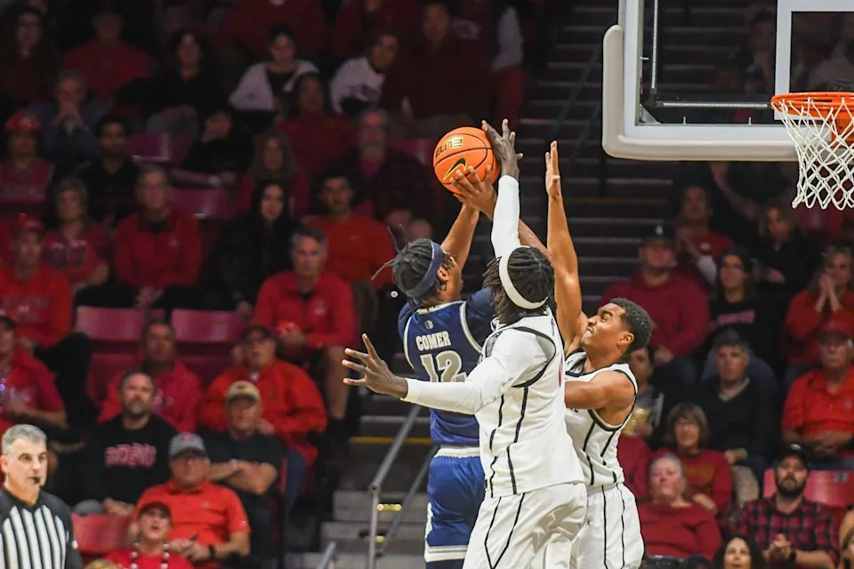 SDSU forward Magoon Gwath (0) blocks a shot during an NCAA Basketball game against Nevada Saturday February 14, 2026 in California.