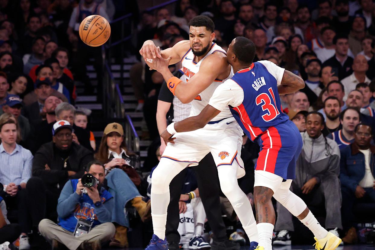 Detroit Pistons guard Javonte Green (31) knocks the ball away from New York Knicks center Karl-Anthony Towns (32) during the first half.