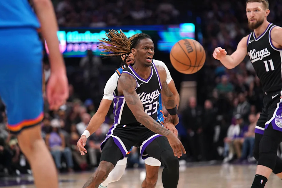 Mar 25, 2025; Sacramento, California, USA; Sacramento Kings guard Keon Ellis (23) has the ball knocked out of his hands by Oklahoma City Thunder guard Isaiah Joe (11) in the second quarter at the Golden 1 Center. Mandatory Credit: Cary Edmondson-Imagn Images