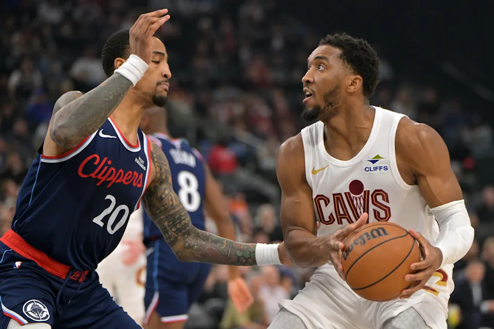 Cleveland Cavaliers guard Donovan Mitchell (45) is fouled by Los Angeles Clippers forward John Collins (20) on Feb. 4, 2026, in Inglewood, California.