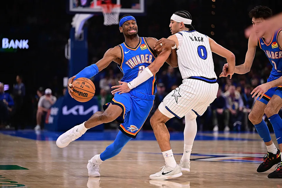 OKLAHOMA CITY, OKLAHOMA - FEBRUARY 3: Shai Gilgeous-Alexander #2 of the Oklahoma City Thunder attempts to drive the ball past Anthony Black #0 of the Orlando Magic during the first half at Paycom Center on February 3, 2026 in Oklahoma City, Oklahoma. NOTE TO USER: User expressly acknowledges and agrees that, by downloading and or using this photograph, User is consenting to the terms and conditions of the Getty Images License Agreement. (Photo by Joshua Gateley/Getty Images)