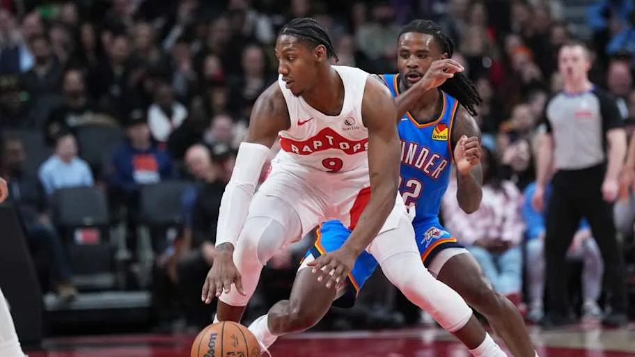 Toronto Raptors forward RJ Barrett dribbles against Oklahoma City Thunder guard Cason Wallace
