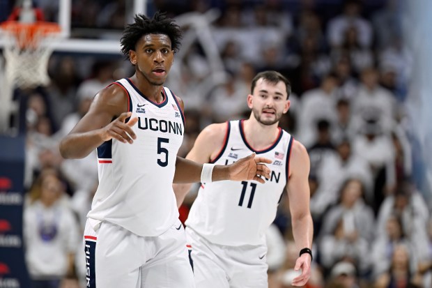 UConn forward Tarris Reed Jr. (5) and UConn forward Alex Karaban (11) in the second half of an NCAA college basketball game, Monday, Nov. 10, 2025, in Storrs, Conn. (AP Photo/Jessica Hill)