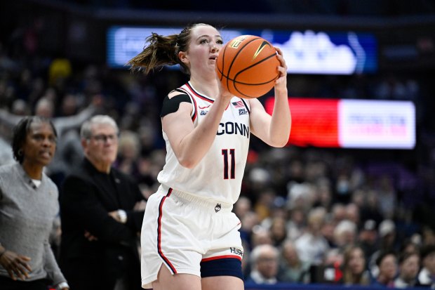 UConn guard Allie Ziebell (11) shoots the ball in the second half of an NCAA college basketball game against Xavier, Wednesday, Jan. 28, 2026, in Storrs, Conn. (AP Photo/Jessica Hill)
