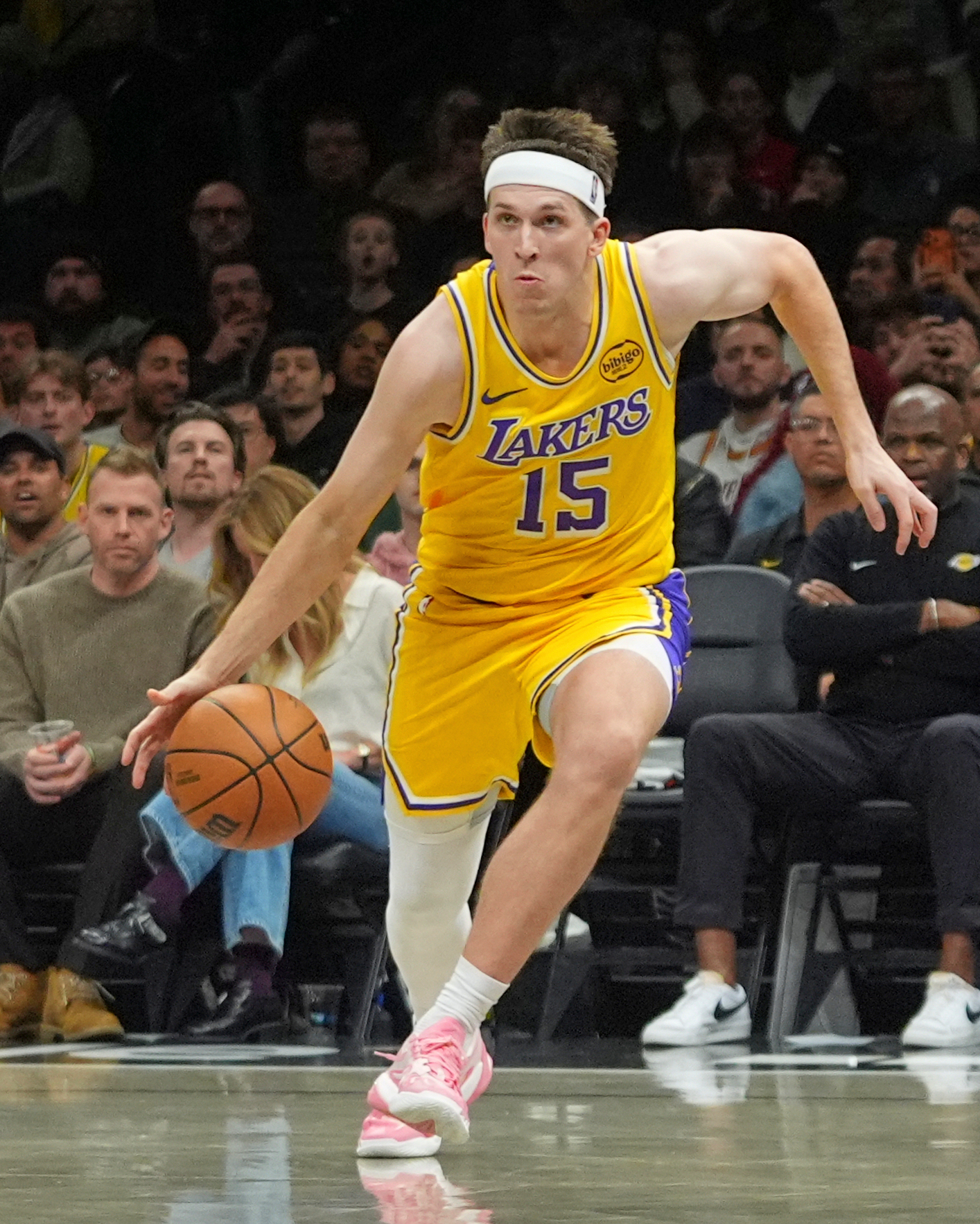 Lakers guard Austin Reaves drives to the basket during the...