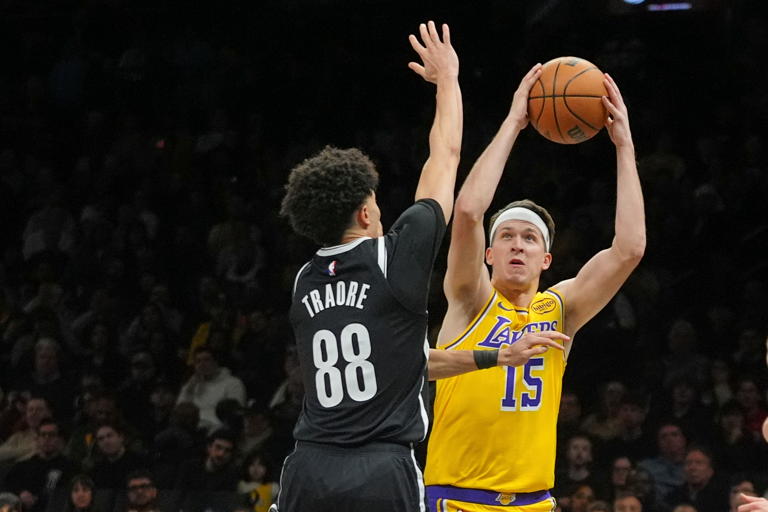 Lakers guard Austin Reaves shoots as the Brooklyn Nets’ Nolan...