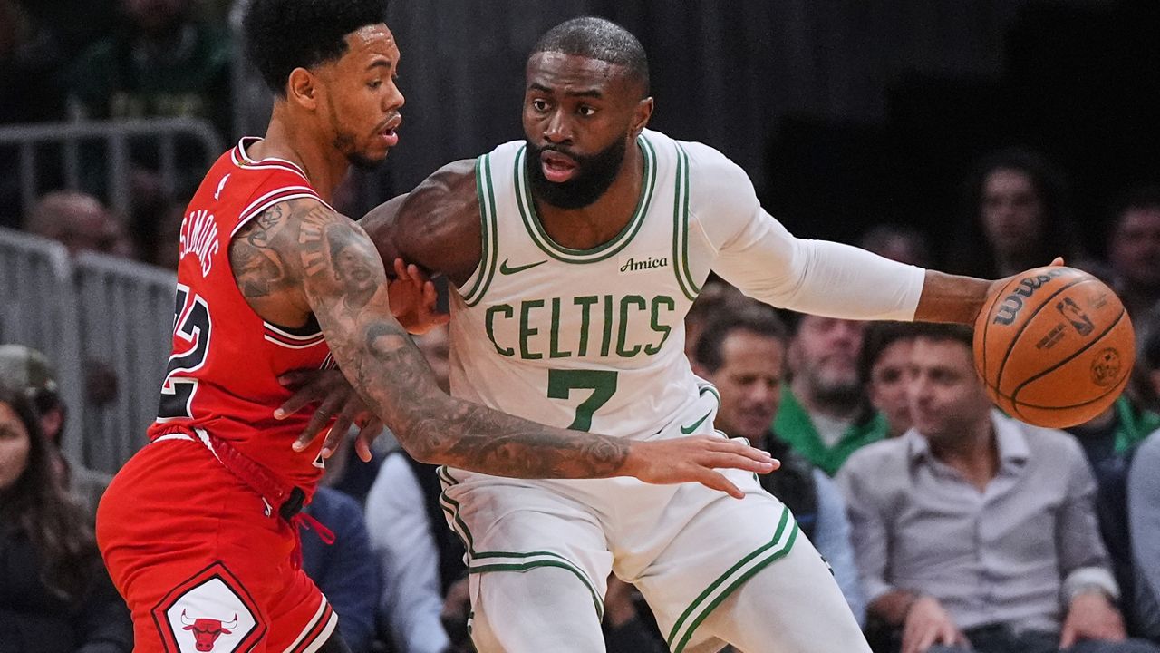 Chicago Bulls guard Anfernee Simons (22) pressures Boston Celtics guard Jaylen Brown (7) during the first half of an NBA basketball game, Wednesday, Feb. 11, 2026, in Boston. (AP Photo/Charles Krupa)