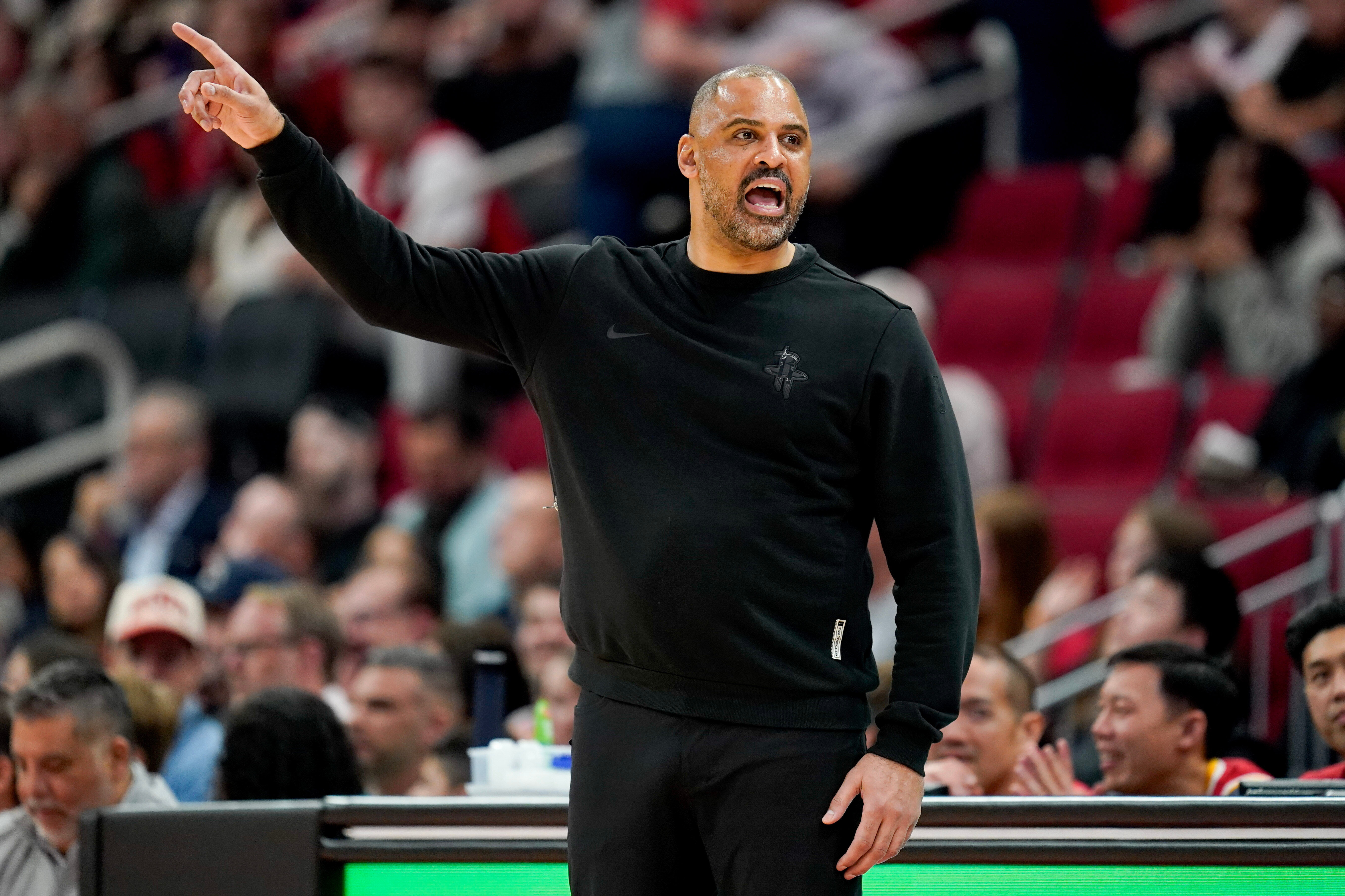 Houston Rockets head coach Ime Udoka instructs his team from...