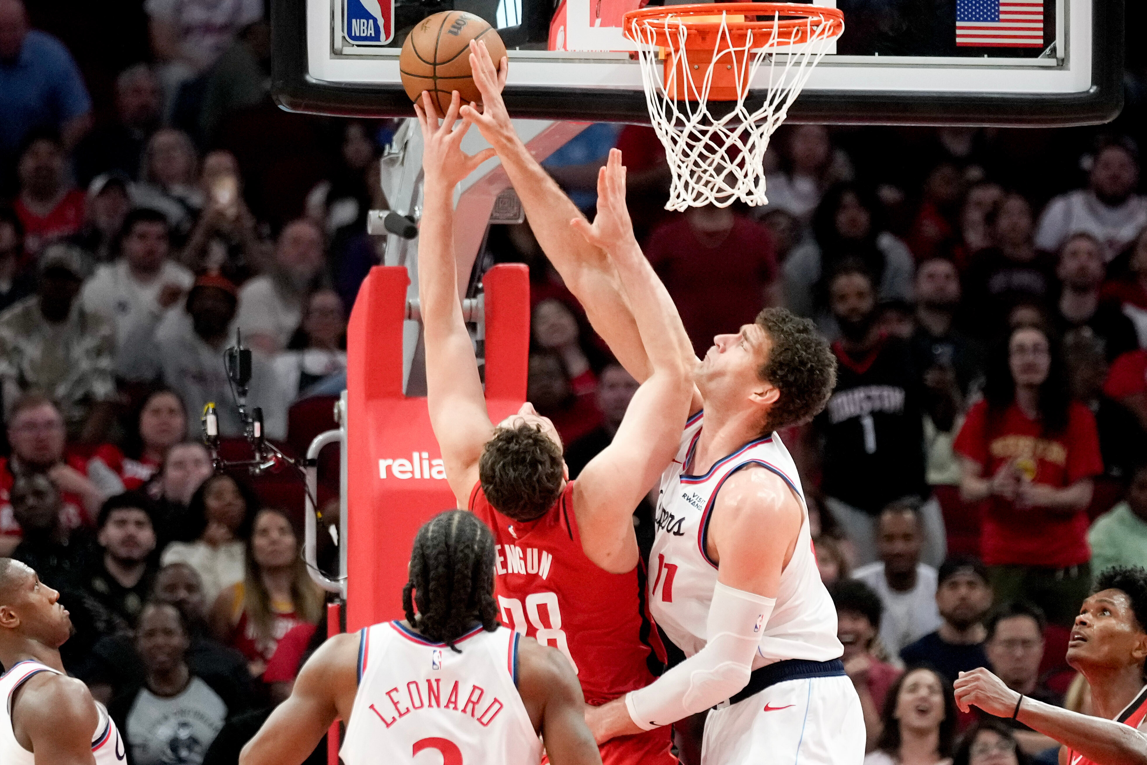 Clippers center Brook Lopez, right, blocks the shot of the...