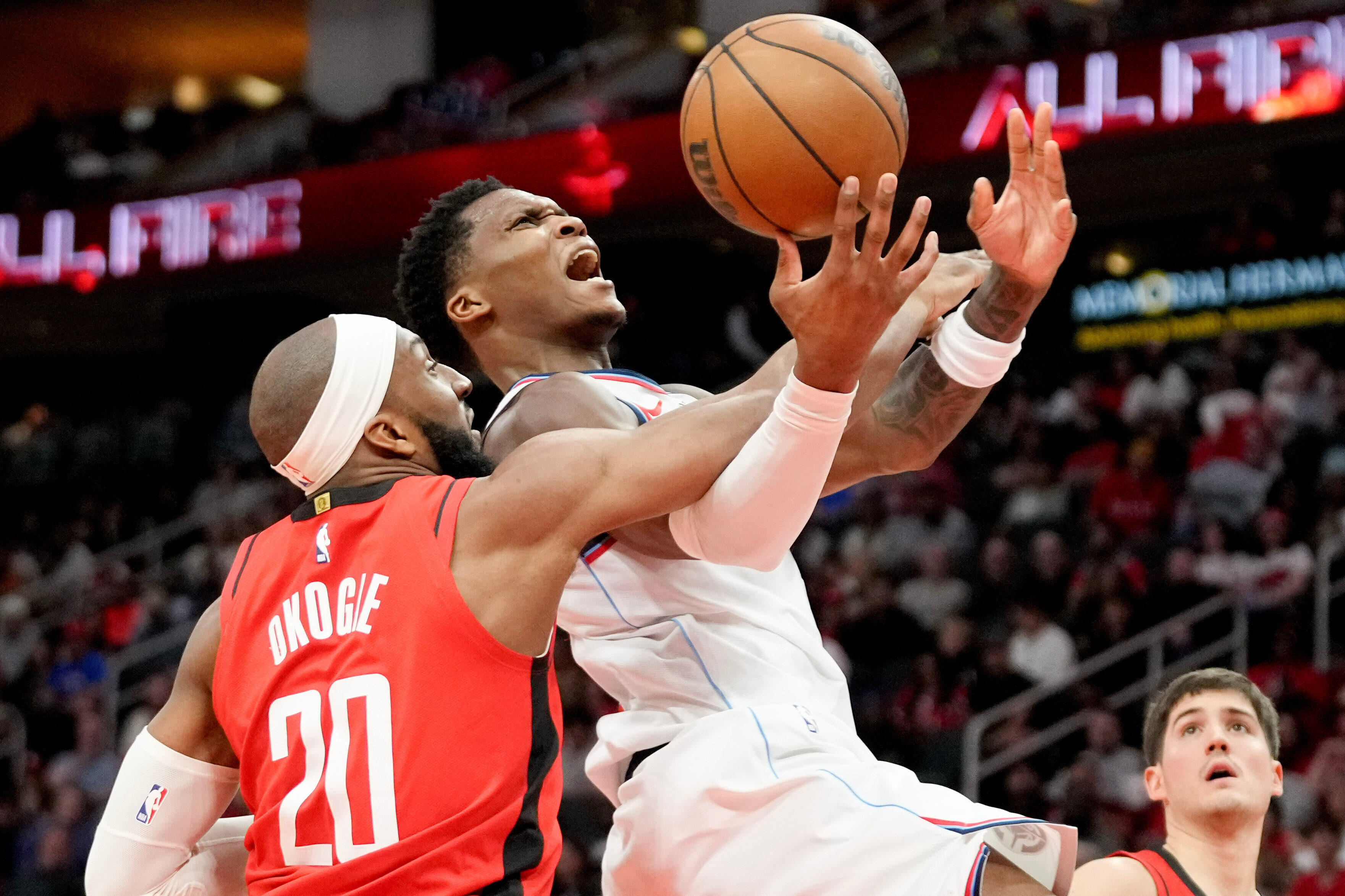 Clippers guard Benedict Mathurin, right, is fouled by Houston Rockets...