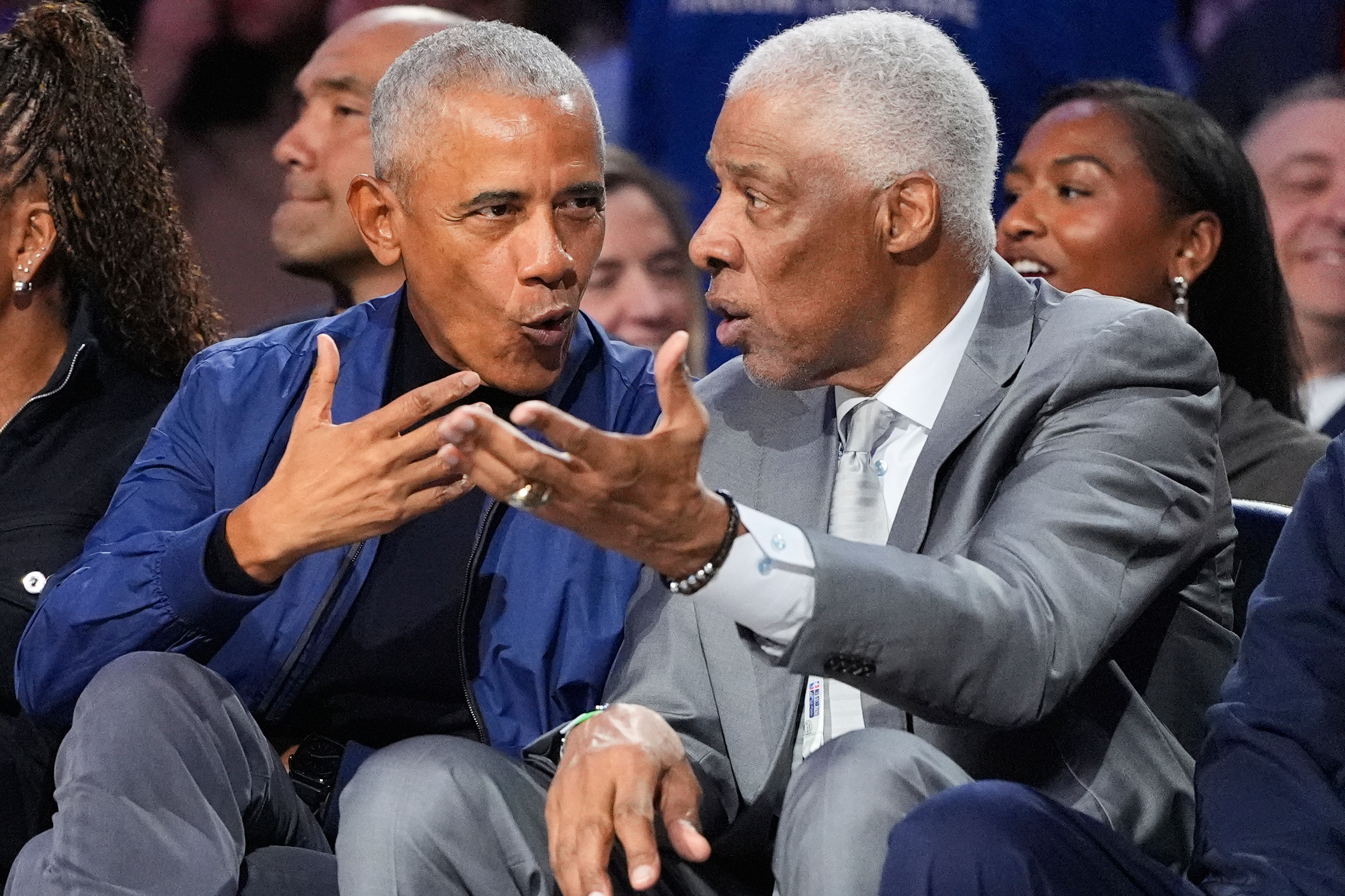 Barack Obama talks to Julius Erving during the NBA All-Star...
