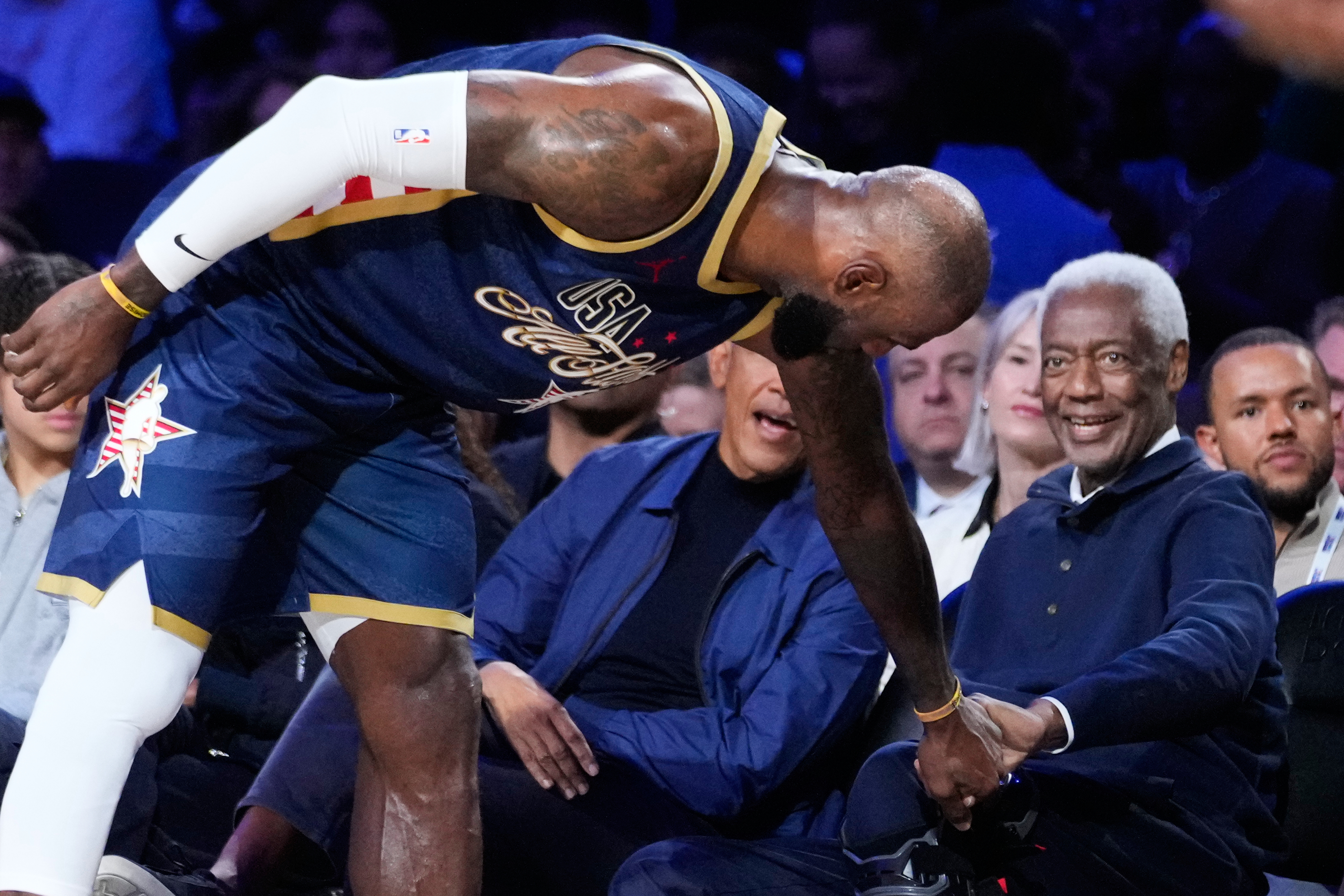 USA Stripes forward LeBron James (23) shakes hands with Oscar...