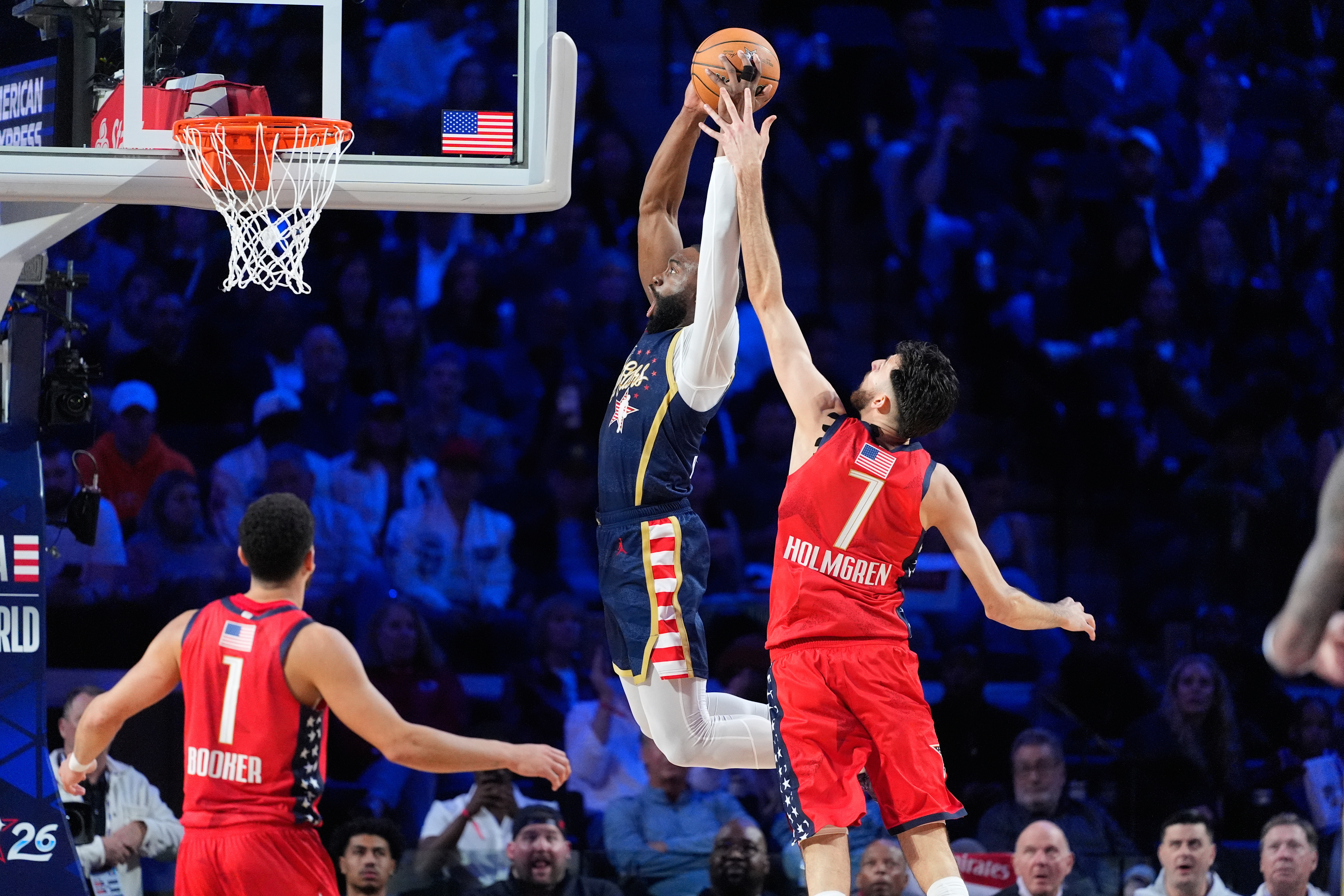 USA Stripes guard Jaylen Brown dunks past USA Stars center...