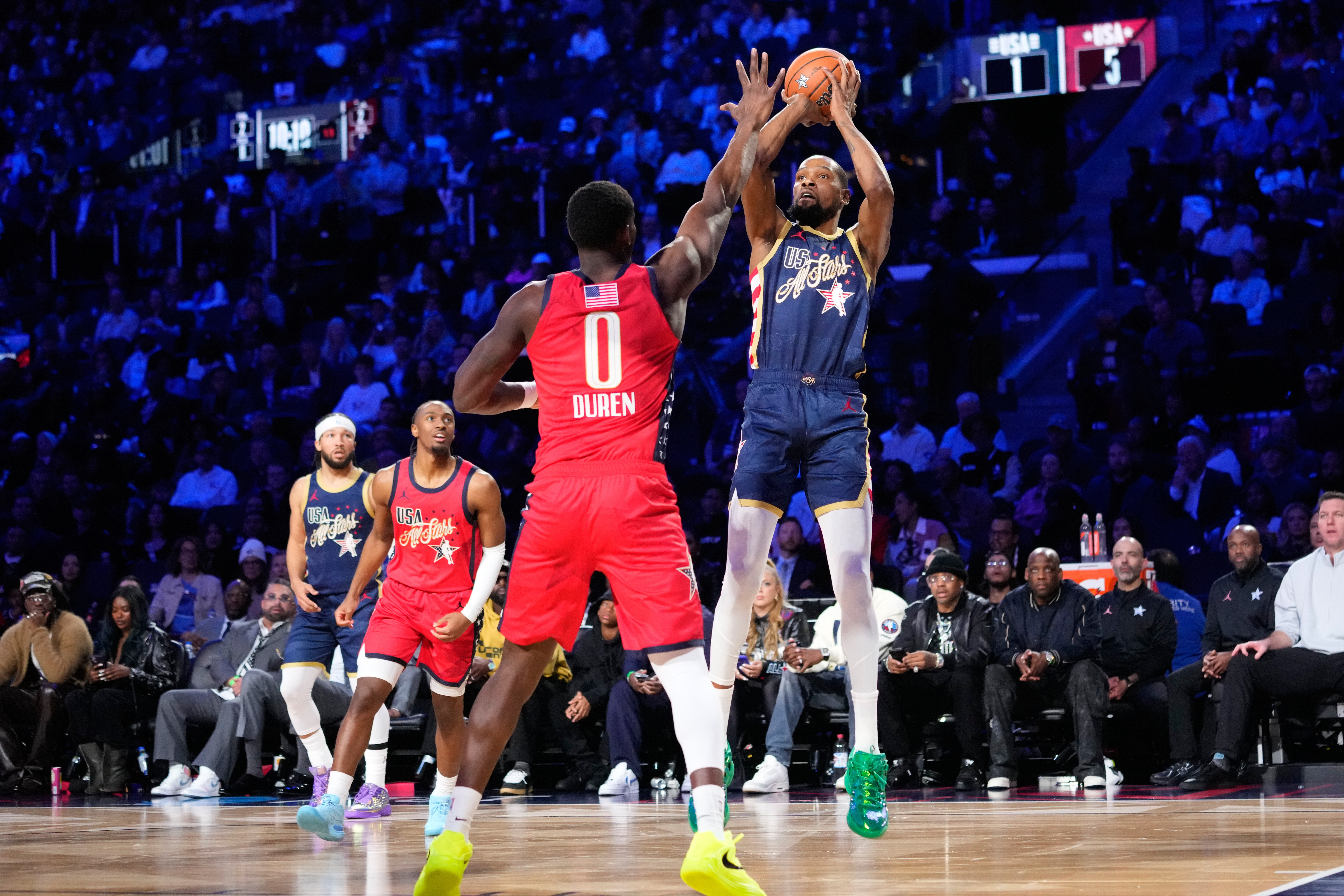 USA Stripes forward Kevin Durant shoots over USA Stars forward...