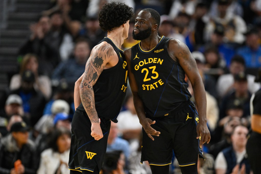 Draymond Green celebrates with Warriors teammate Gui Santos.