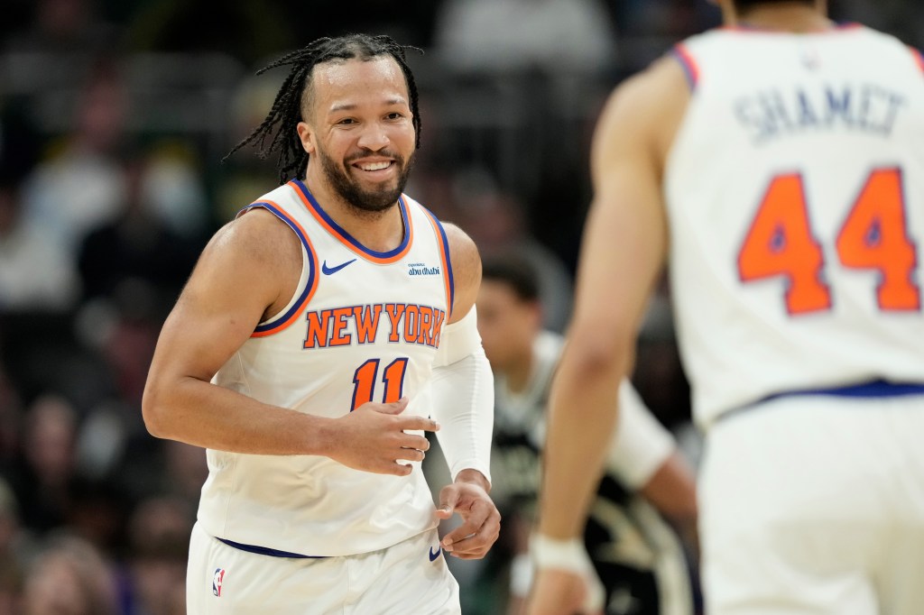New York Knicks' Jalen Brunson smiles during the first half of an NBA basketball game against the Milwaukee Bucks, Friday, Feb. 27, 2026, in Milwaukee. 