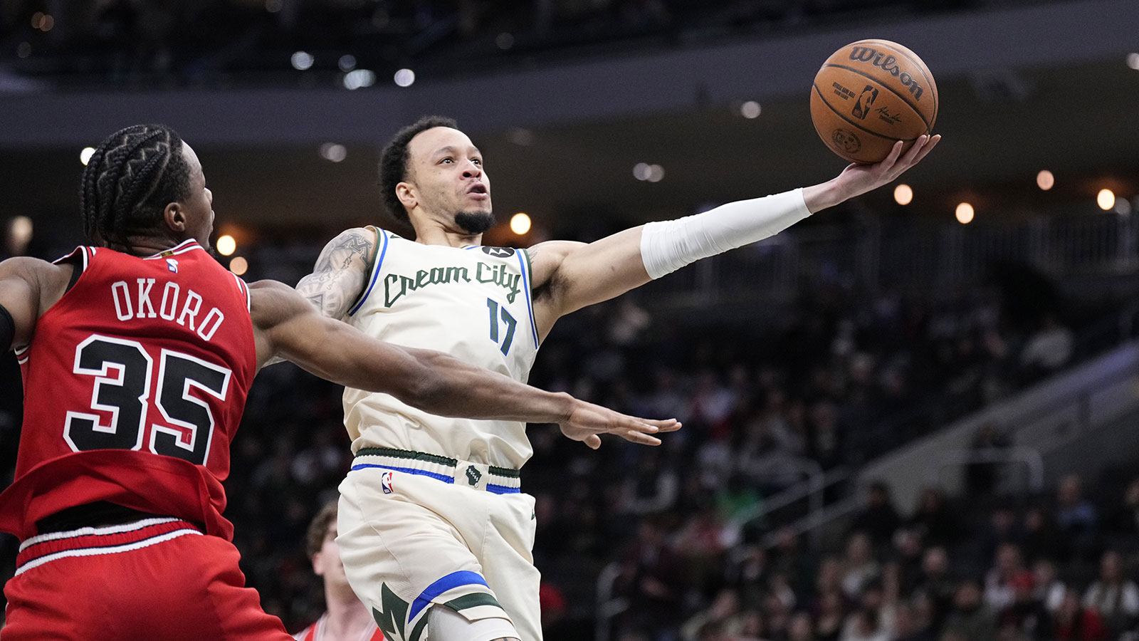 Milwaukee Bucks guard/forward Amir Coffey (17) drives to the basket against Chicago Bulls forward/guard Isaac Okoro (35) in the second half at Fiserv Forum.