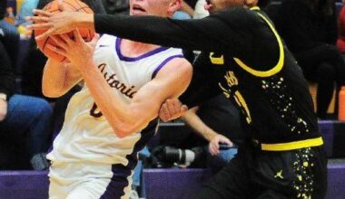 Local basketball dribbles, shoots and scores