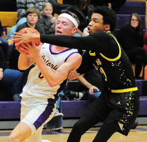 Local basketball dribbles, shoots and scores