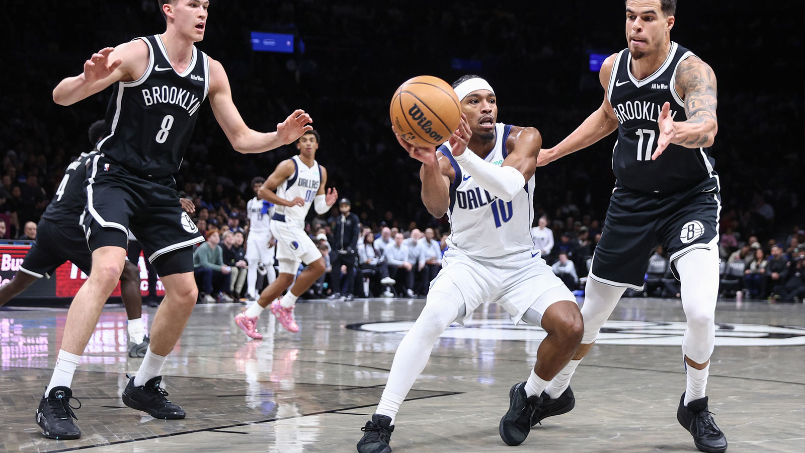 Dallas Mavericks guard Brandon Williams (10) looks to make a pass against Brooklyn Nets forward Michael Porter Jr. (17) in the third quarter at Barclays Center.