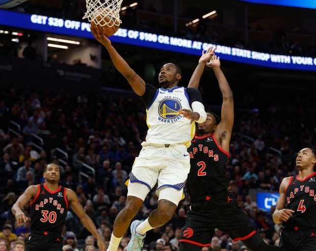 Golden State Warriors' Jonathan Kuminga (1) takes a shot against Toronto Raptors' Jonathan Mogbo (2) in the third quarter at the Chase Center in San Francisco, Calif., on Tuesday, Jan. 20, 2026. (Nhat V. Meyer/Bay Area News Group)