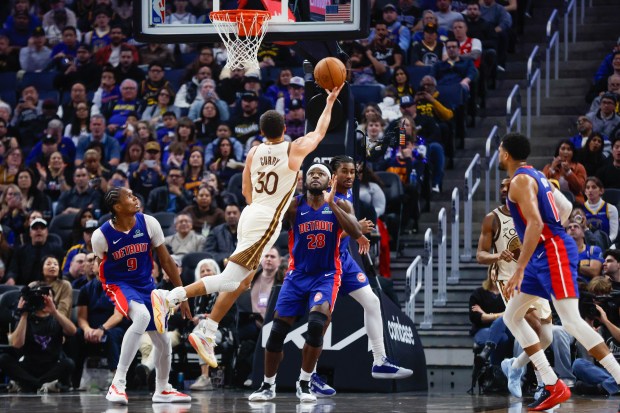 Golden State Warriors' Stephen Curry (30) takes a shot against Detroit Pistons' Isaiah Stewart (28) in the third quarter at the Chase Center in San Francisco, Calif., on Friday, Jan. 30, 2026. (Shae Hammond/Bay Area News Group)