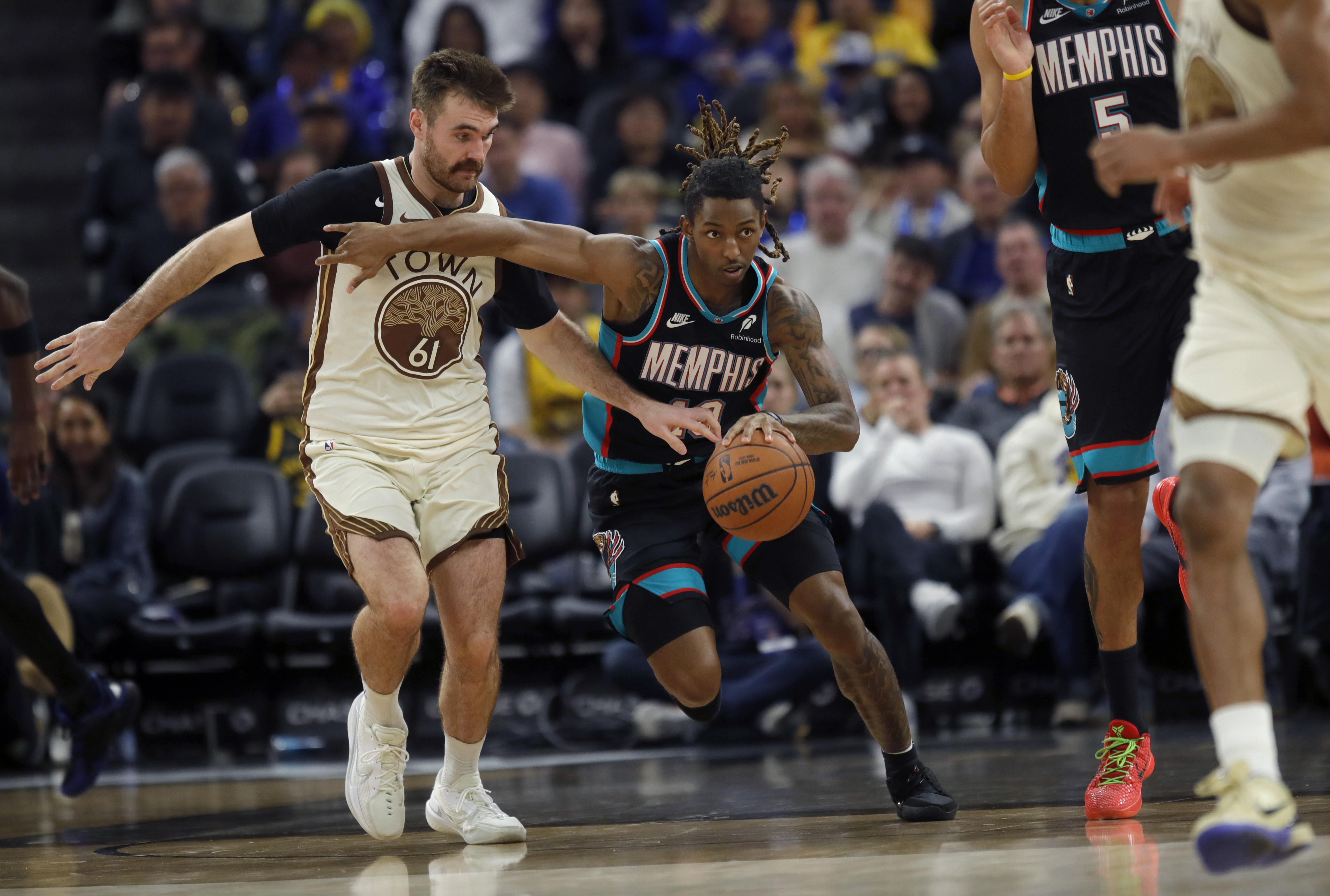 Memphis Grizzlies’ Javon Small #10 is guarded by Golden State...