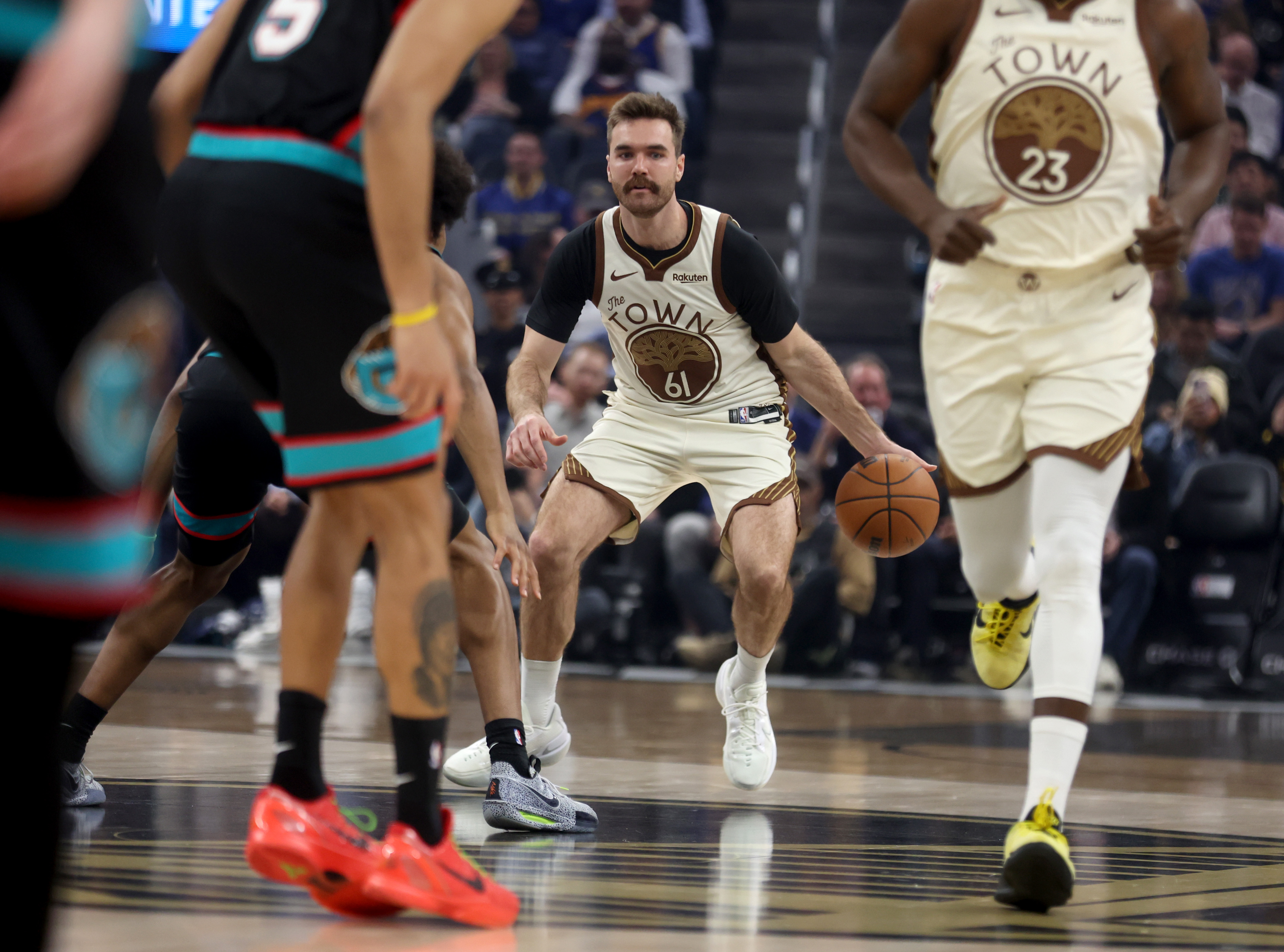Golden State Warriors’ Pat Spencer #61 brings the ball downcourt...