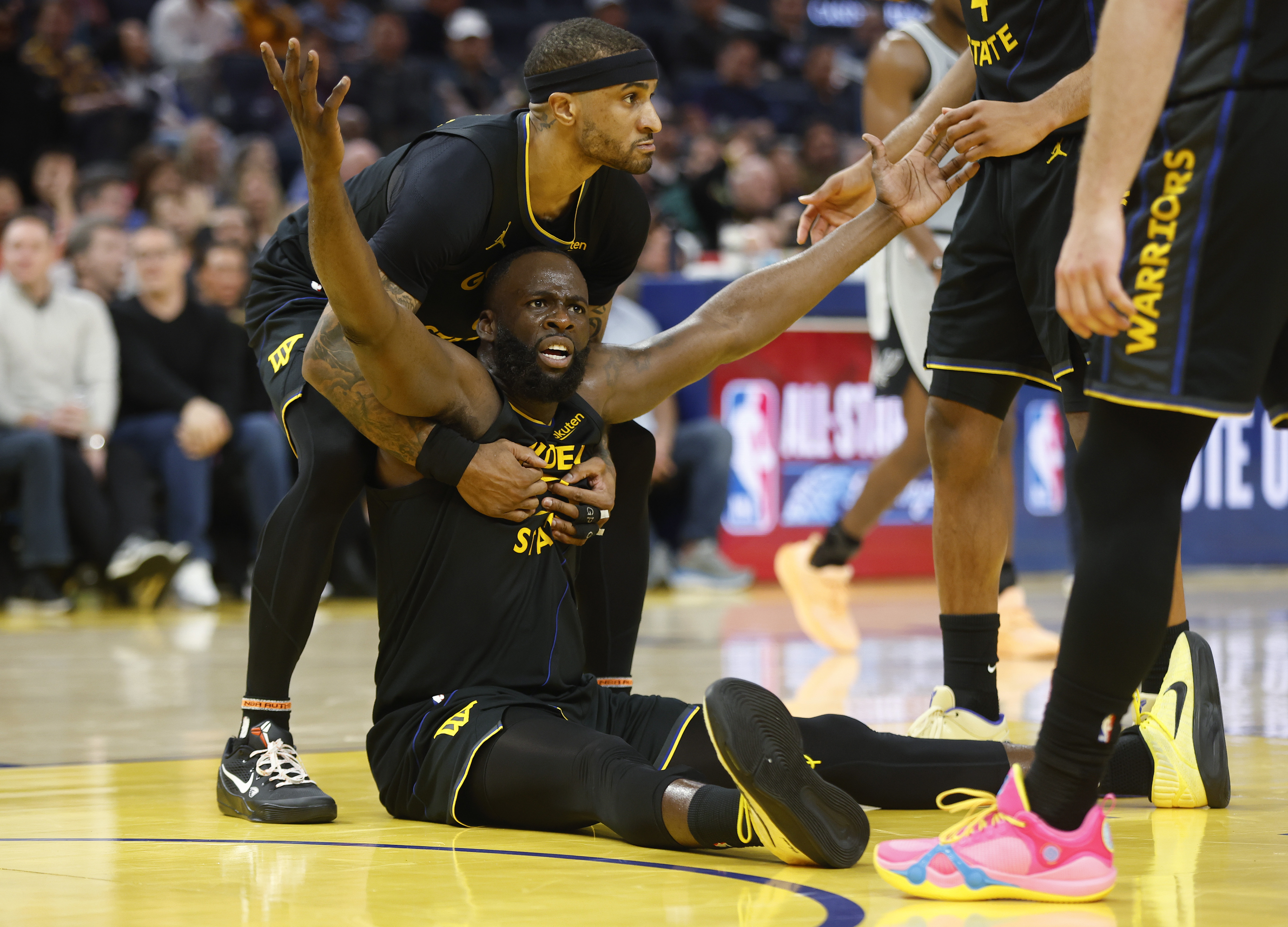 Golden State Warriors' Draymond Green (23) reacts to a foul...
