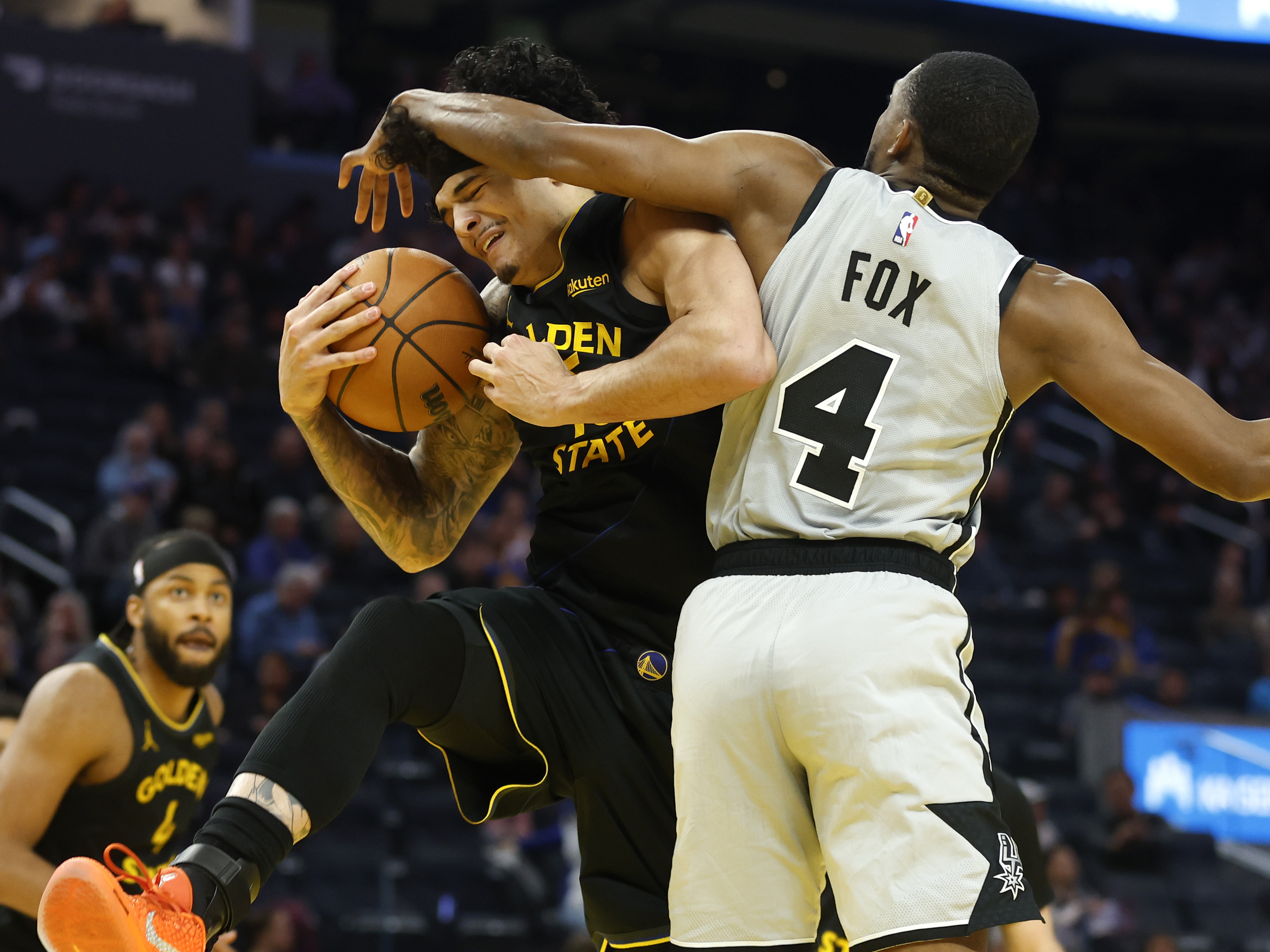 Golden State Warriors' Gui Santos (15) fights for a rebound...
