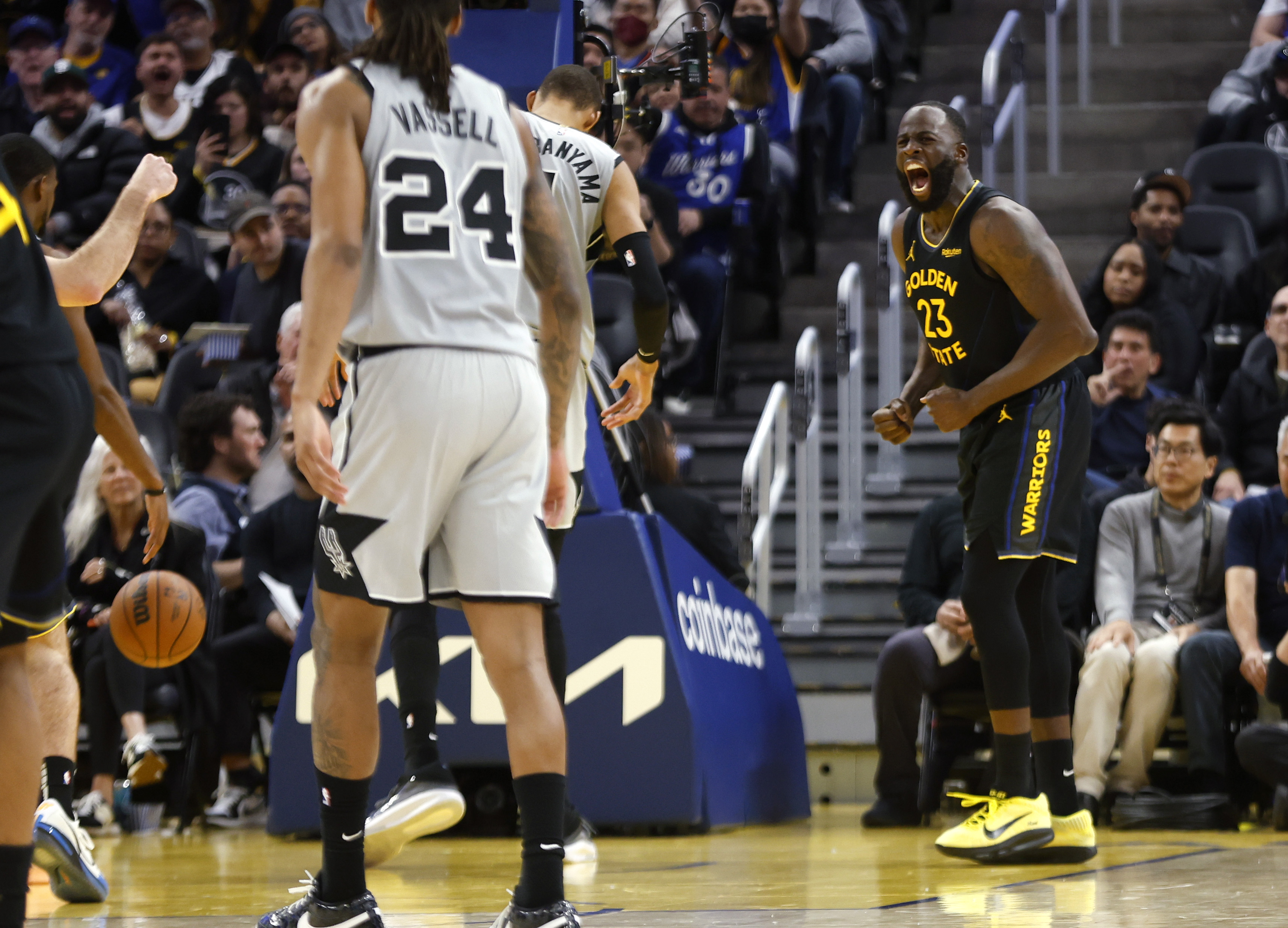 Golden State Warriors' Draymond Green (23) celebrates his basket and...