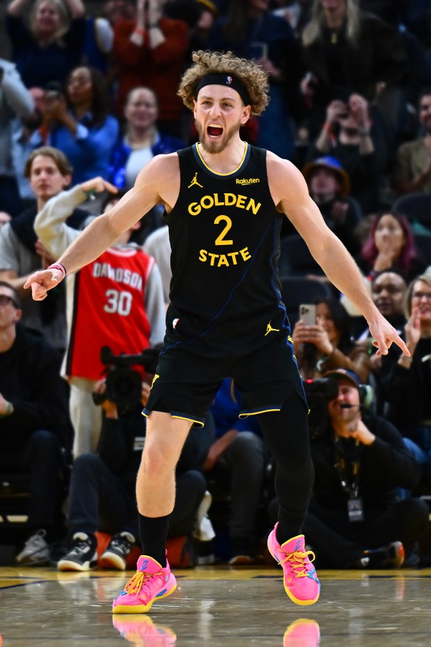 Golden State Warriors' Brandin Podziemski (2) reacts after making a 3-point basket in the fourth quarter of their NBA game at Chase Center in San Francisco, Calif., on Sunday, Feb. 22, 2026. The Golden State Warriors defeated the Denver Nuggets 128-117. (Jose Carlos Fajardo/Bay Area News Group)