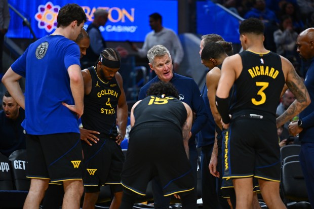 Golden State Warriors head coach Steve Kerr huddles up with his players before the start of the third quarter of their NBA game at Chase Center in San Francisco, Calif., on Sunday, Feb. 22, 2026. The Golden State Warriors defeated the Denver Nuggets 128-117. (Jose Carlos Fajardo/Bay Area News Group)