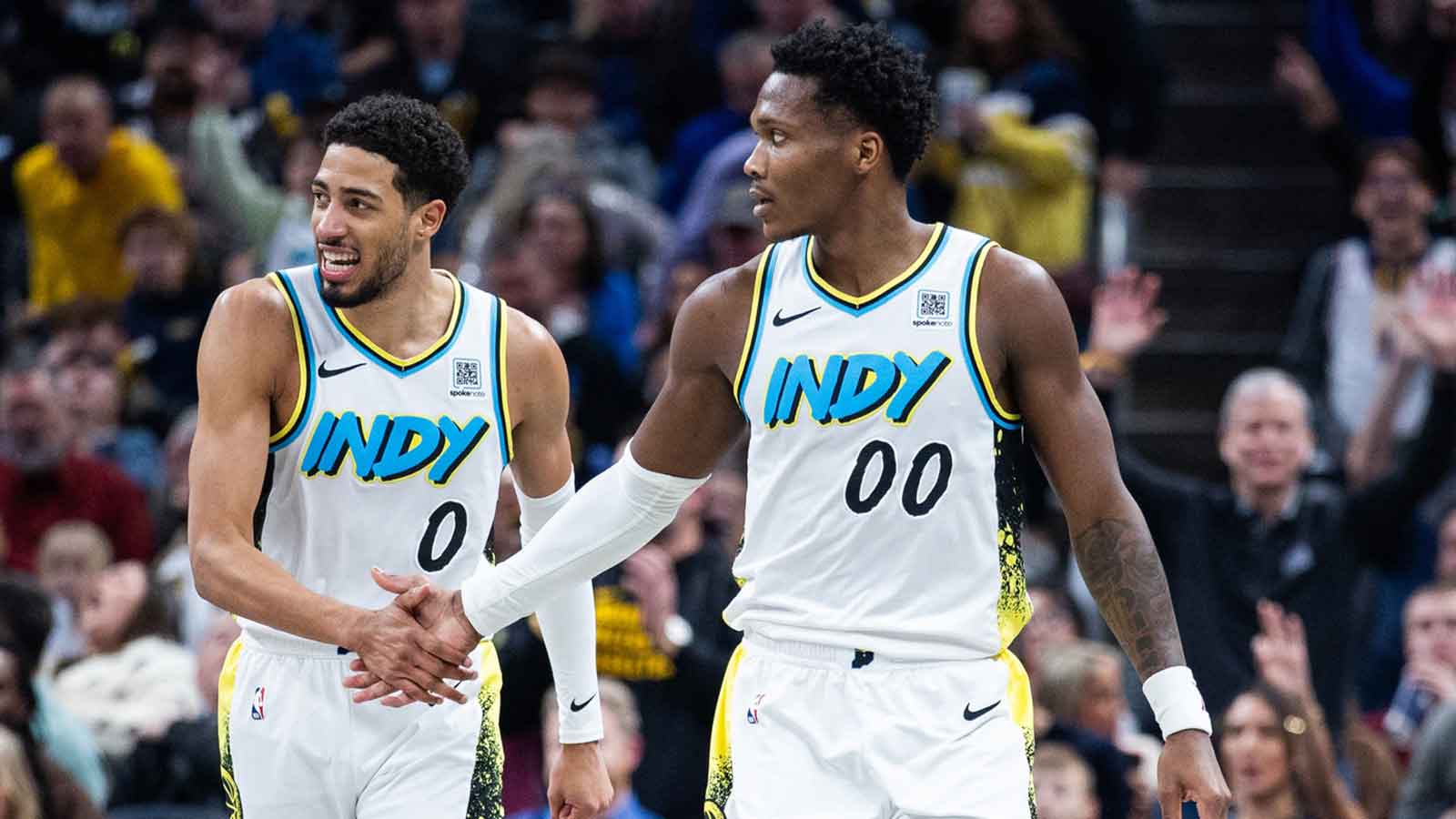 Indiana Pacers guard Bennedict Mathurin (00) celebrates a made shot with guard Tyrese Haliburton (0) in the second half against the Milwaukee Bucks at Gainbridge Fieldhouse.