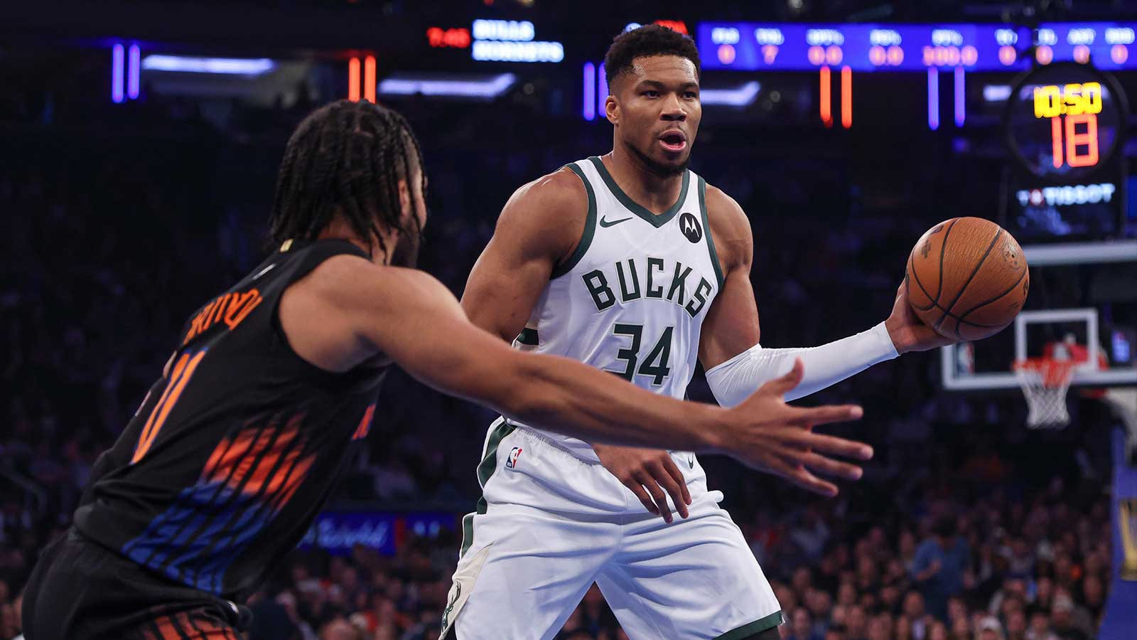 Milwaukee Bucks forward Giannis Antetokounmpo (34) looks to pass as New York Knicks guard Jalen Brunson (11) defends during the first half at Madison Square Garden.