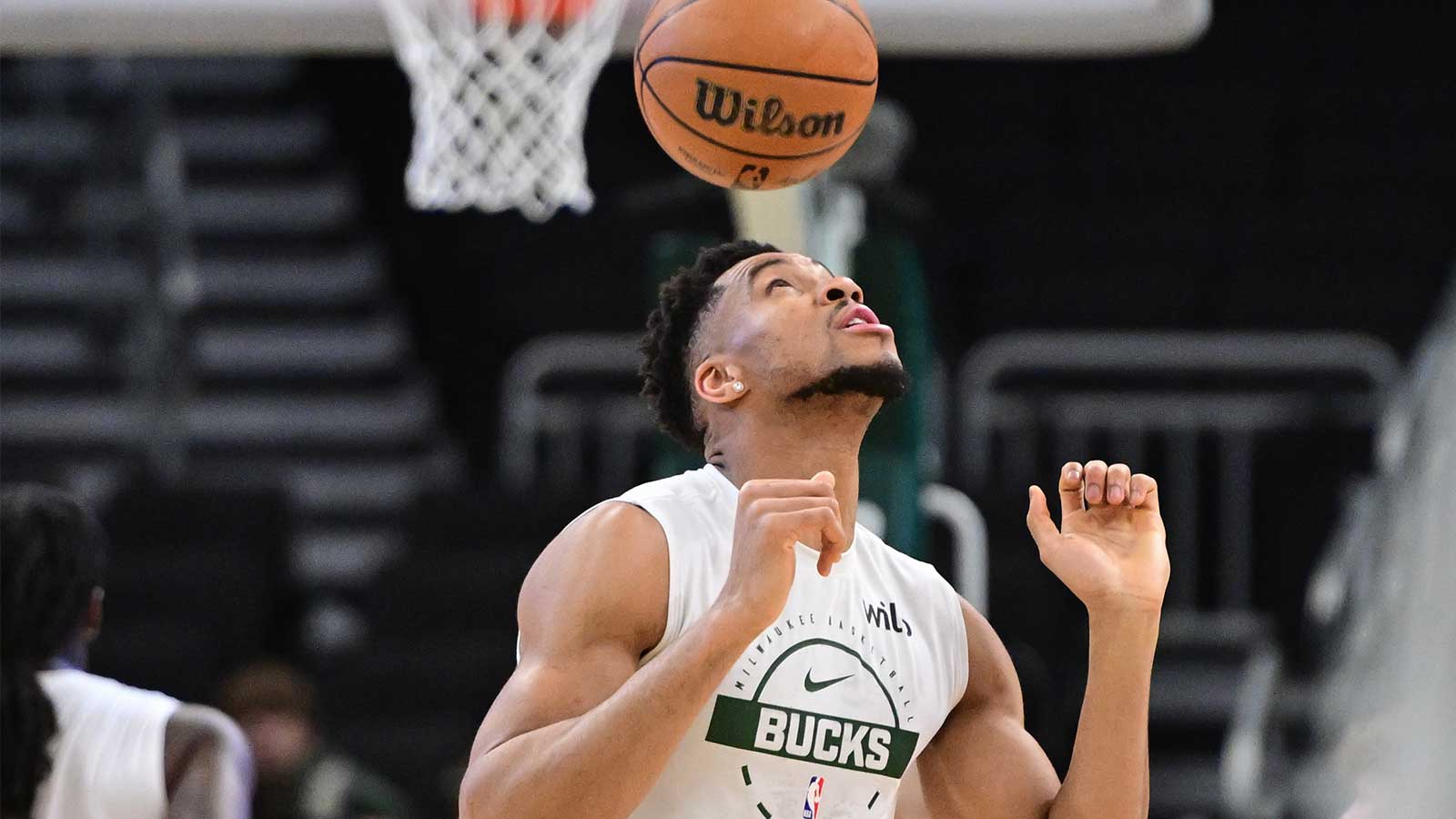 Milwaukee Bucks forward Giannis Antetokounmpo (34) bounces the ball on his head while warming up before game against the Indiana Pacers at Fiserv Forum. 
