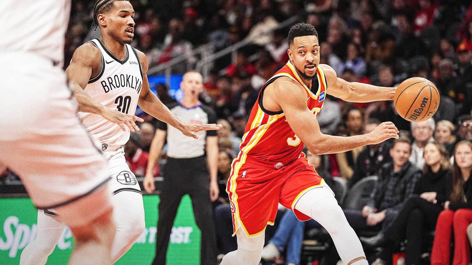 Atlanta Hawks guard CJ McCollum (3) dribbles against the Brooklyn Nets during the second half at State Farm Arena.