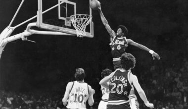 The Sixers' Julius Erving dunks over the Chicago Bulls' Artis Gilmore during first half of a game in Philadelphia on Jan. 3, 1979.