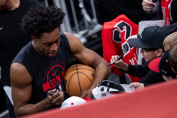 Chicago Bulls guard Collin Sexton signs autographs for young fans ahead of a game against the Portland Trail Blazers at the United Center in Chicago on Feb. 26, 2026. (Josh Boland/Chicago Tribune)