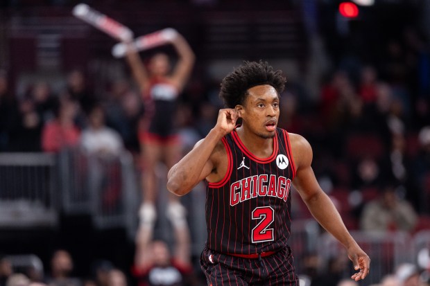 Chicago Bulls guard Collin Sexton (2) struggles to hear Chicago Bulls head coach Billy Donovan in the first half of a game against the Portland Trail Blazers at the United Center in Chicago on Feb. 26, 2026. (Josh Boland/Chicago Tribune)