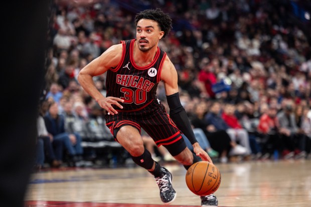 Chicago Bulls guard Tre Jones (30) carries the ball in the first half of a game against the Portland Trail Blazers at the United Center in Chicago on Feb. 26, 2026. (Josh Boland/Chicago Tribune)
