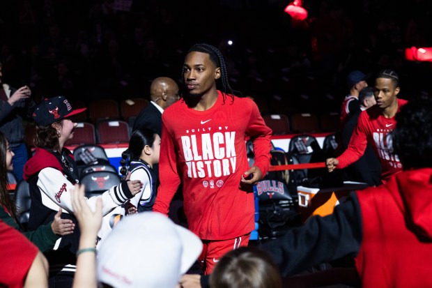 Chicago Bulls guard Rob Dillingham and forward Isaac Okoro run out onto the court in the first half of a game against the Portland Trail Blazers at the United Center in Chicago on Feb. 26, 2026. (Josh Boland/Chicago Tribune)