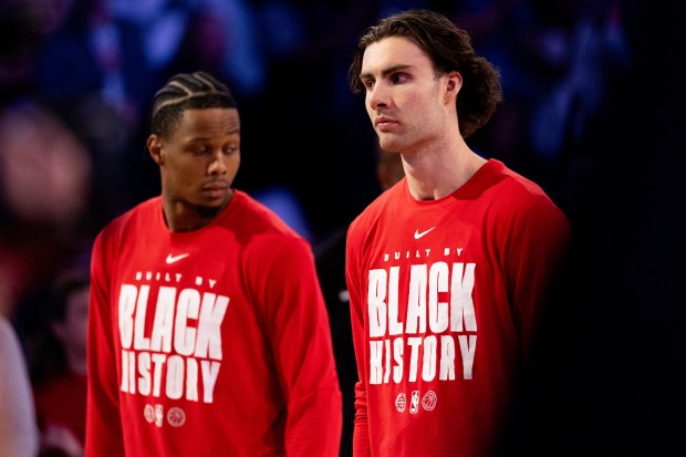 Chicago Bulls forward Isaac Okoro and guard Josh Giddey stand for the national anthem in the first half of a game against the Portland Trail Blazers at the United Center in Chicago on Feb. 26, 2026. (Josh Boland/Chicago Tribune)