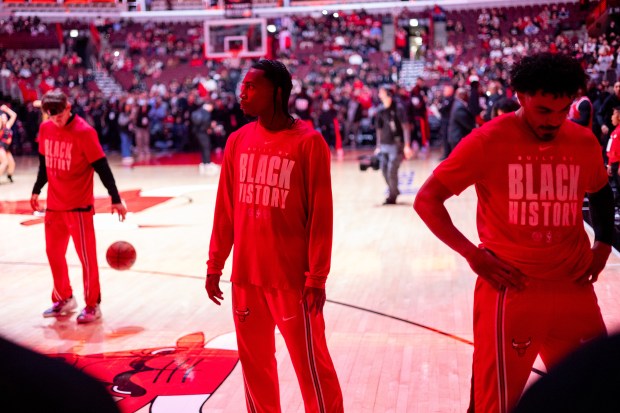 Chicago Bulls guard Rob Dillingham and guard Tre Jones stand on the court ahead of team introductions in the first half of a game against the Portland Trail Blazers at the United Center in Chicago on Feb. 26, 2026. (Josh Boland/Chicago Tribune)