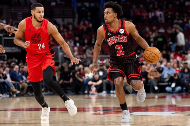 Chicago Bulls guard Collin Sexton (2) carries the ball against Portland Trail Blazers forward Kris Murray (24) in the first half of a game against the Portland Trail Blazers at the United Center in Chicago on Feb. 26, 2026. (Josh Boland/Chicago Tribune)
