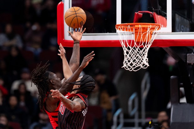 Chicago Bulls guard Rob Dillingham attempts to block a shot by Portland Trail Blazers guard Jrue Holiday in the first half of a game against the Portland Trail Blazers at the United Center in Chicago on Feb. 26, 2026. (Josh Boland/Chicago Tribune)