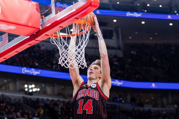 Chicago Bulls forward Matas Buzelis (14) dunks the ball in the first half of a game against the Portland Trail Blazers at the United Center in Chicago on Feb. 26, 2026. (Josh Boland/Chicago Tribune)