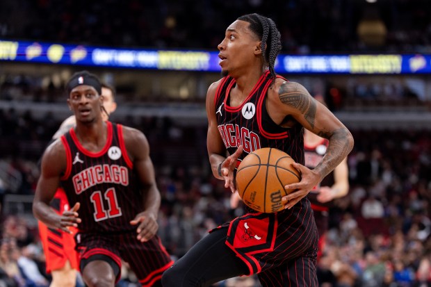 Chicago Bulls guard Rob Dillingham carries the ball as teammate forward Leonard Miller sets himself for a rebound in the first half of a game against the Portland Trail Blazers at the United Center in Chicago on Feb. 26, 2026. (Josh Boland/Chicago Tribune)
