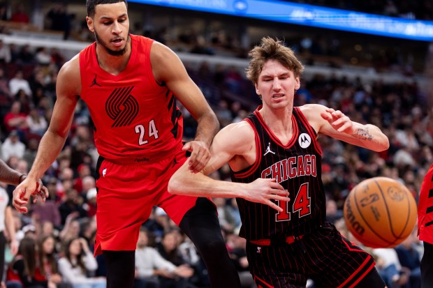 Chicago Bulls forward Matas Buzelis (14) loses the basketball to Portland Trail Blazers forward Kris Murray (24) in the first half of a game against the Portland Trail Blazers at the United Center in Chicago on Feb. 26, 2026. (Josh Boland/Chicago Tribune)