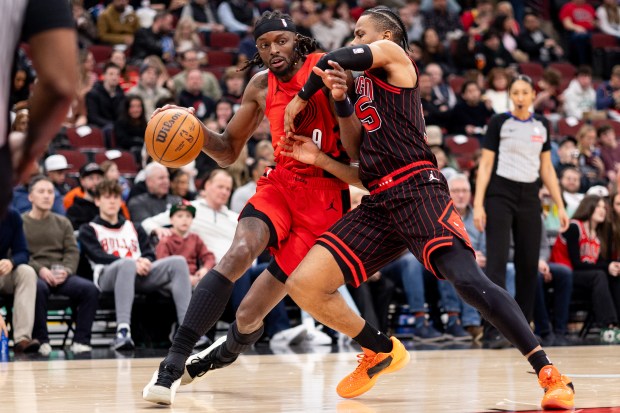 Portland Trail Blazers forward Jerami Grant (9) carries the ball against Chicago Bulls forward Isaac Okoro (35) in the second half of a game against the Portland Trail Blazers at the United Center in Chicago on Feb. 26, 2026. (Josh Boland/Chicago Tribune)